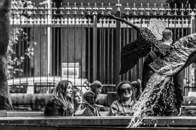 Laughing by the fountain