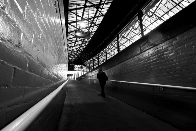 From under the tracks