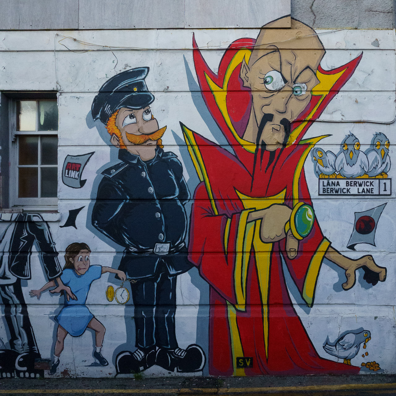 Ming The Merciless, a policeman and a child drawn on the wall of a building.