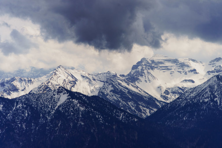 Mountains on the German and Austrian border. Dark clouds threaten rain and snow.