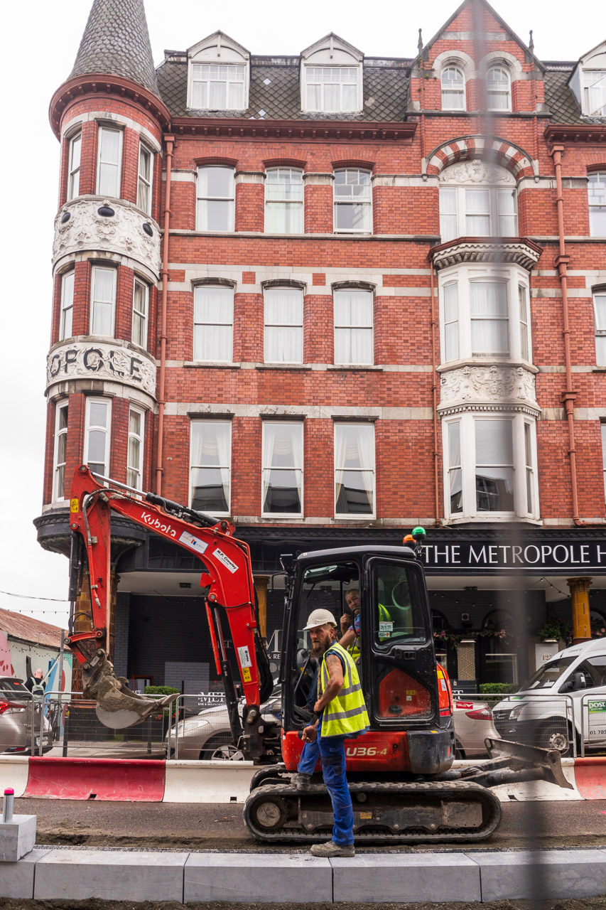 Men working on the building site that is McCurtain Street Cork with the Metropole Hotel in the background