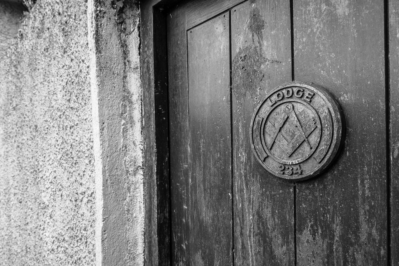 A door with a sign on the it saying "Lodge 234" and the Square and compass logo associated with them.