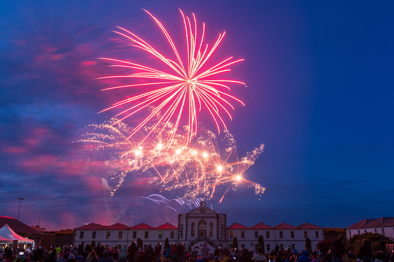Fireworks light up the sky above the buildings of Spike Island