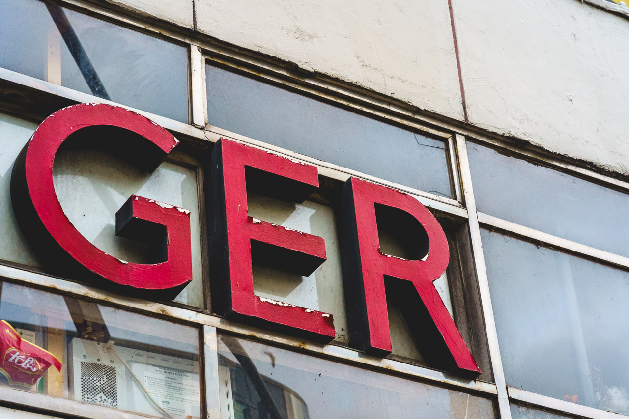 The text "GER" from the name "SINGER", a garment alternation centre in the middle of Cork City.