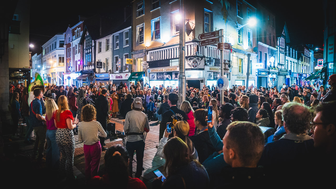 A large crowd watching Boolaboom perform in front of the GPO in Cork on Friday night