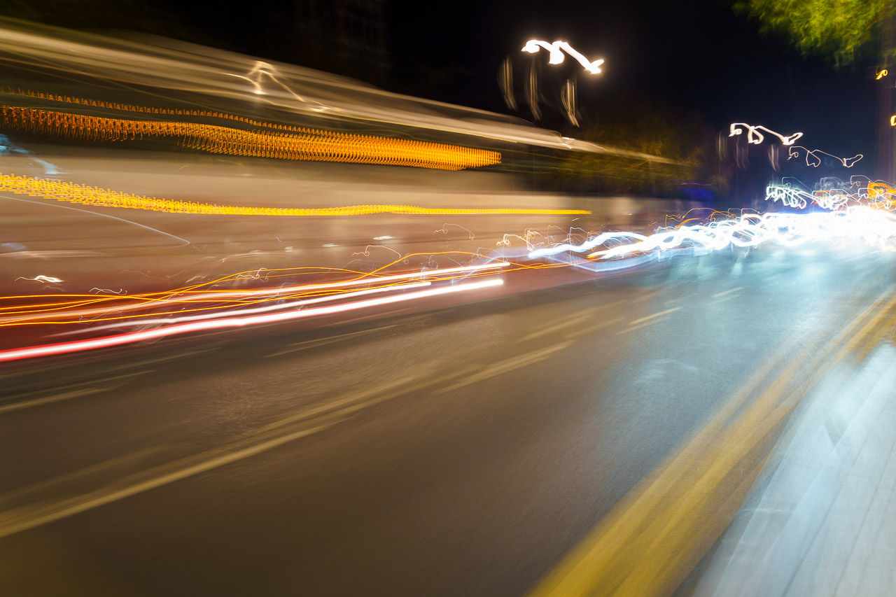 Light streaks of passing traffic on a street.