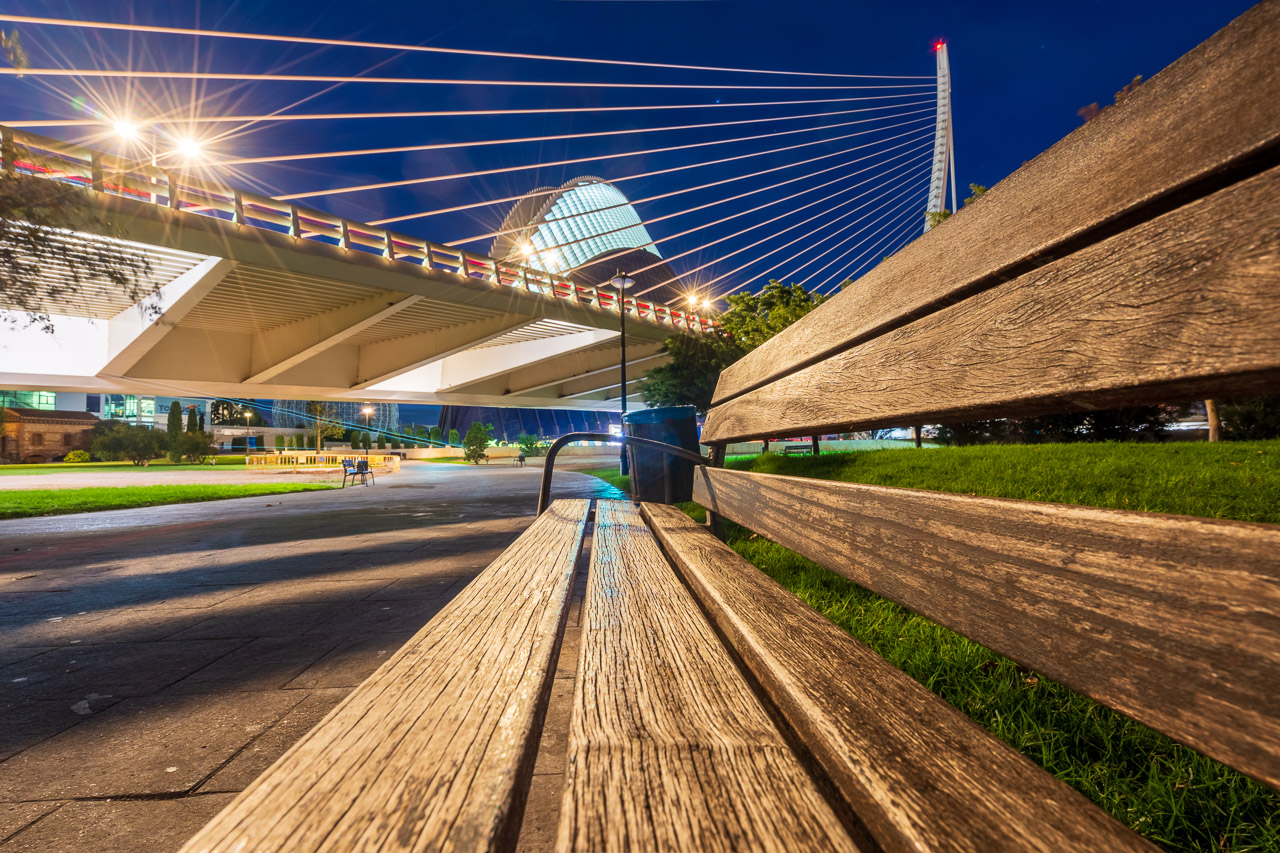The Pont l'Assut de l'Or in Valencia, Spain seen from the viewpoint of a bench underneath. The Caixa Forum can be seen behind it.