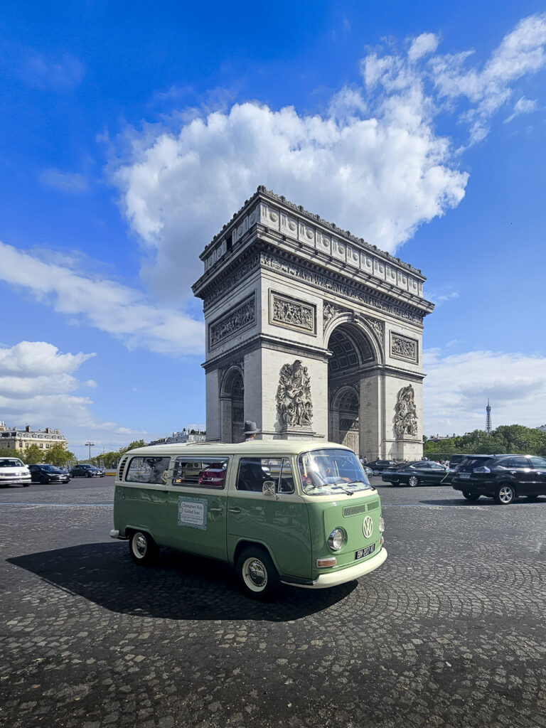 A VW bus at the Arc de Triomphe