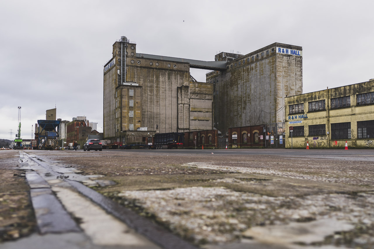 R&H Hall stands on Kennedy Quay before any demolition work took place. The flat area of the quay is visible in front.