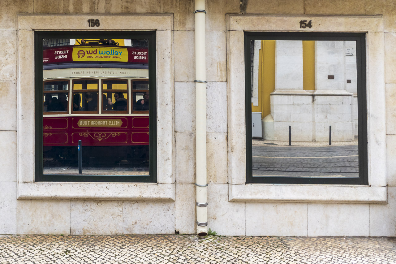 I took a tourist tram around Lisbon. Here it is reflected in a window a building we passed.