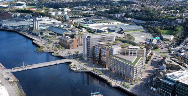 A view of the proposed development on Kennedy Quay showing the Rehabilitation Hospital at the junction with Victoria Road, the residential block, the three office buildings, including the new Silo building and the re-purposed Odlums building. 