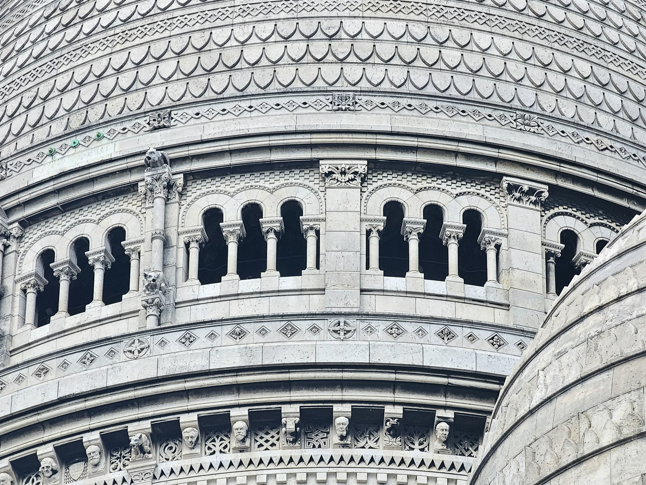 The roof of the Basilique du Sacré-Cœur de Montmartre. All curves and patterns, repeating windows and patterns.